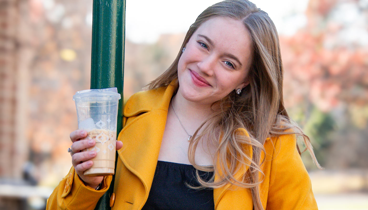 Dressed up pretty and drinking a latte